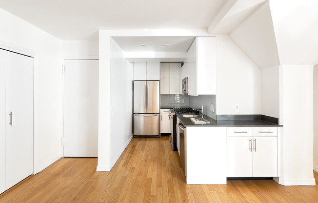 Remodeled kitchen with stainless steel appliances and plenty of storage in the Upper East Side