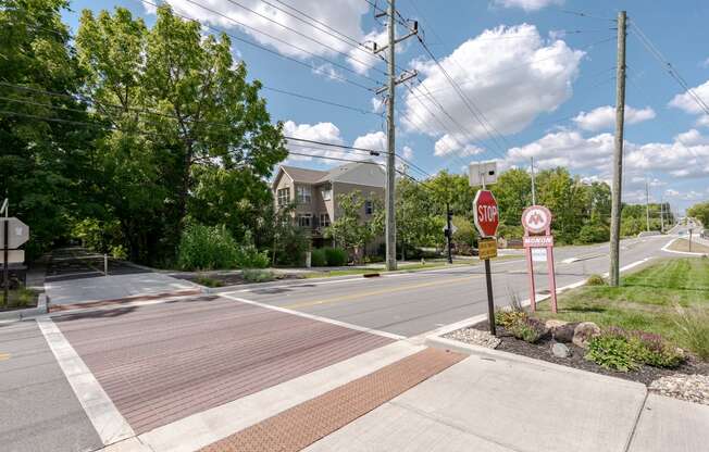 an empty street with a stop sign at an intersection