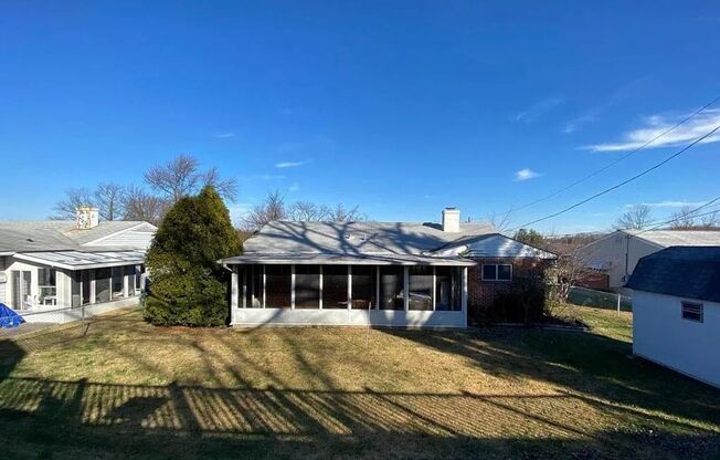 Charming Parkville Single Family Home with Sunroom & Private Backyard
