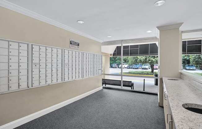 the locker room at the gym has lockers and a counter top