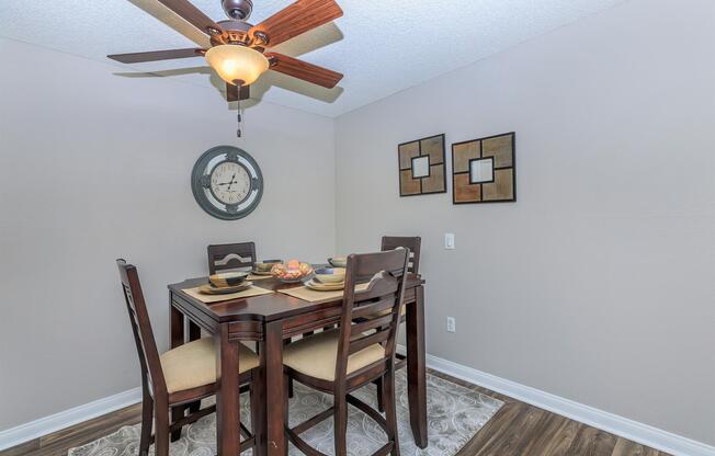 a room that has a clock on a table