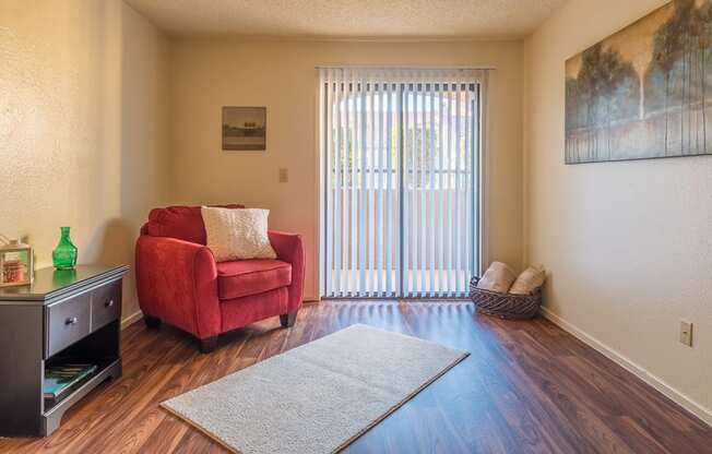 Enclave living room with glass doors and private balcony