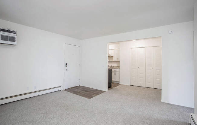 A dining room and a kitchen area in the background at Brookside Apartments, Springfield