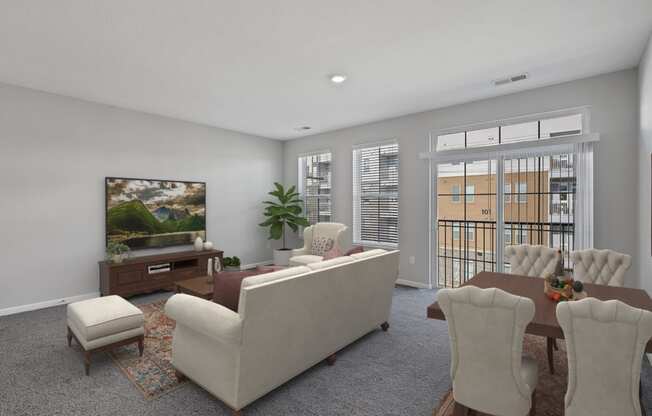 a living room with a couch and chairs and a table