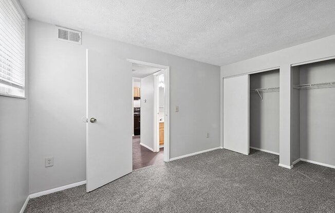 apartment bedroom with a closet