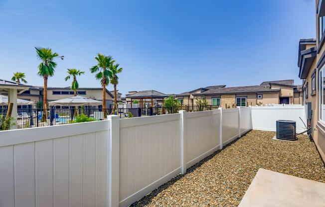 apartments balcony and yard with palm trees at Grandstone at Sunrise, Arizona