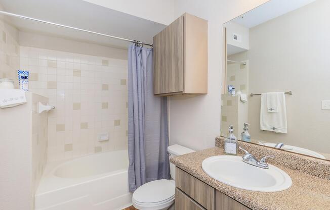 a room with a sink and a mirror