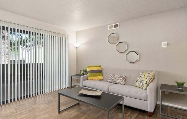a living room with a couch and a table
