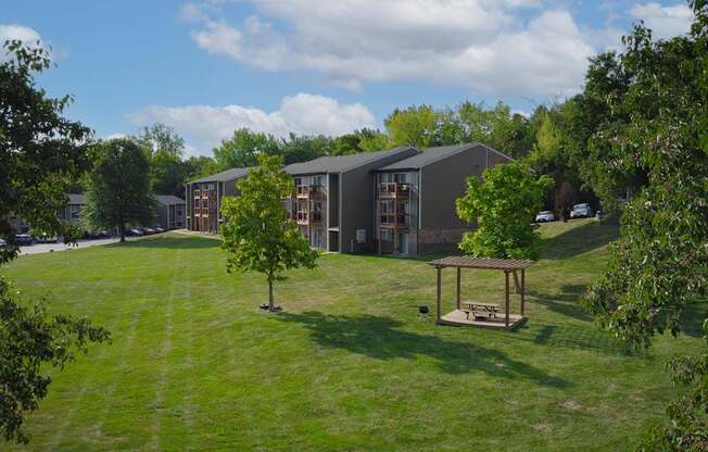 A modern building with a green lawn in front.