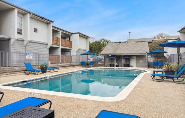 our apartments have a resort style pool and lounge chairs