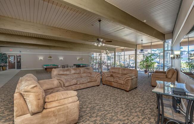 community room with brown couches