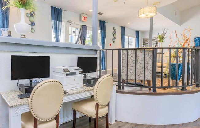 a room filled with furniture and vase of flowers on a table