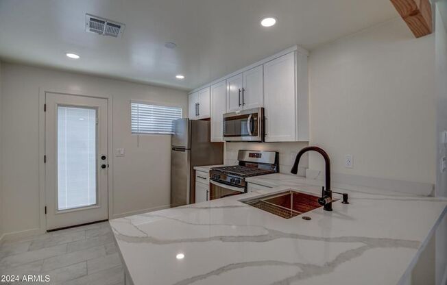 Stunning updated Townhome minutes to ASU campus available October 1st. 2 Bedroom, 1 bathroom completely updated with all appliances including washer and dryer in unit and your owner private yard.   Available October 1, 2026