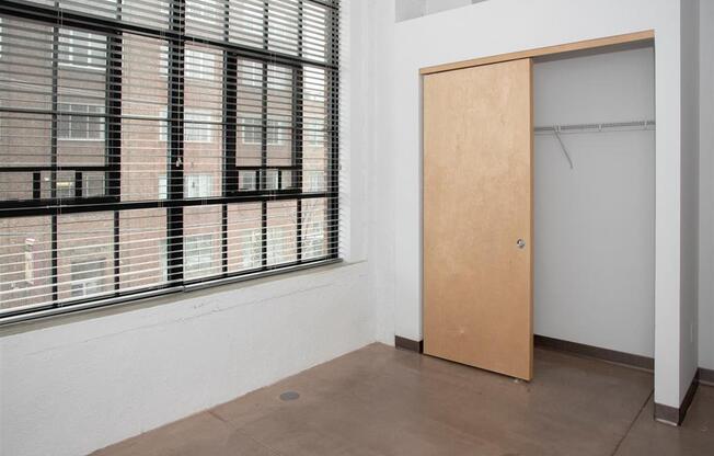 bedroom with closet and large window