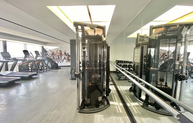 a gym with cardio machines and other exercise equipment