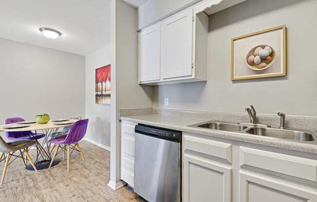white cabinetry with dishwasher at fairway hills apartments