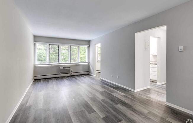 A room with a window and a door.