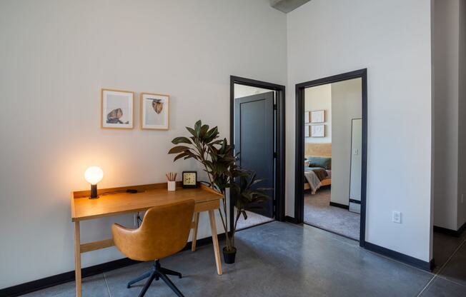 a home office with a desk and chair