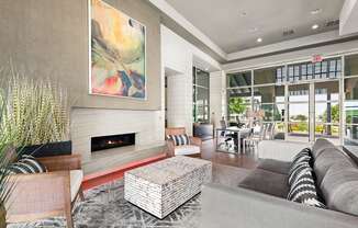 a living room filled with furniture and a fireplace