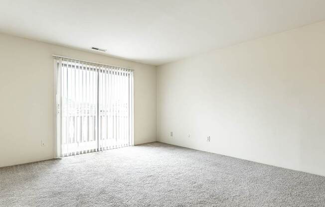 Empty living room with white walls