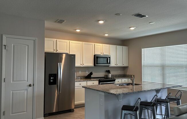 Resort Style Living! Stunning 3/2.5 Townhome in Waterleigh! Available April!