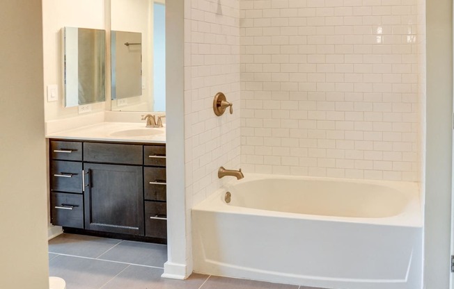 Bathroom with a tub and a sink at The View at Old City, Philadelphia