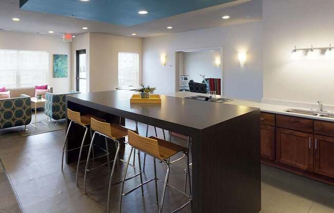 A kitchen with a bar area and a dining area.at Cypress Court, Minnesota
