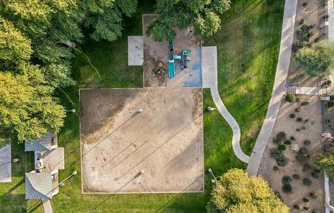 A playground with a slide and a sandbox.