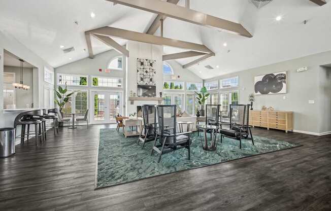 A modern living room with a large rug and a dining table.