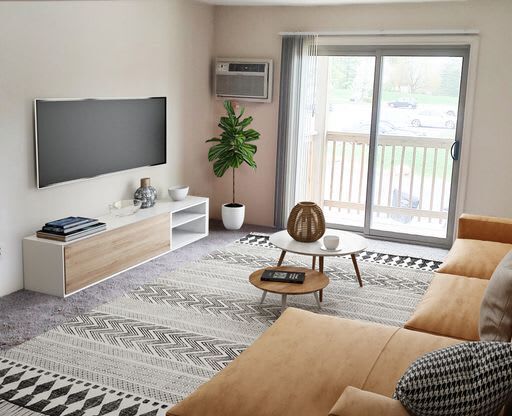 Spacious living room at Mason Hills Apartments in Mason, MI