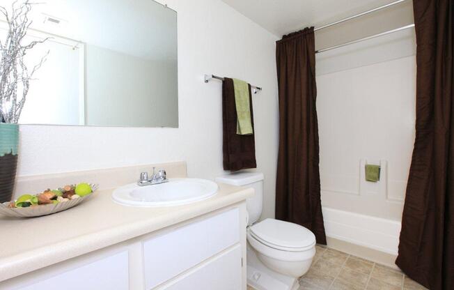 a white sink sitting next to a window