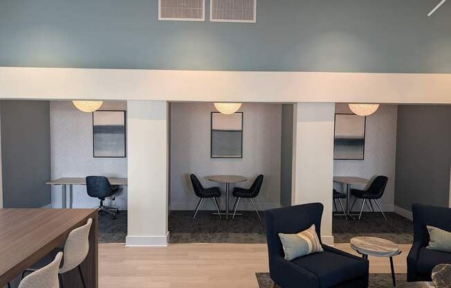 A room with a table, chairs and a couch.