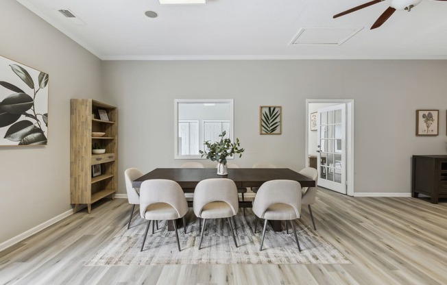 an image of a dining room with a table and chairs