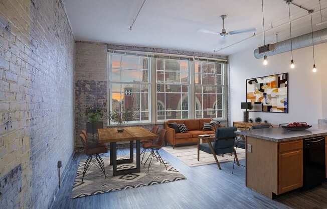 A kitchen with a dining table and chairs in front of a window.