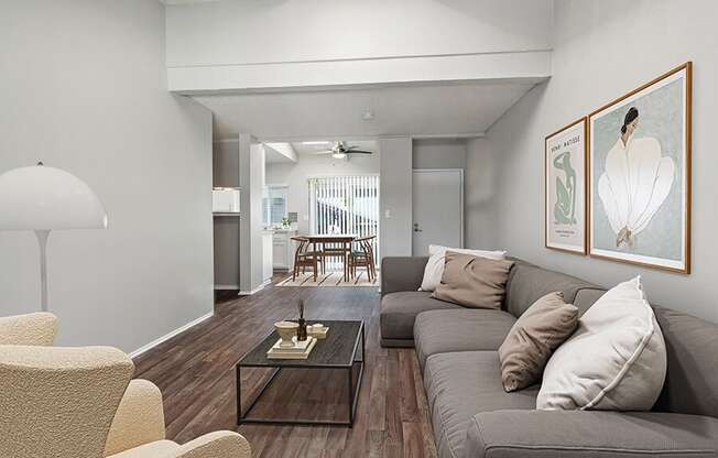 Model Living Room with Wood-Style Flooring at Colonnade at Fletcher Hills Apartments in El Cajon, CA.