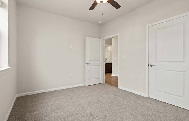Grande at Geyser Falls Luxury Apartments Room with Grey Carpet and Ceiling Fan