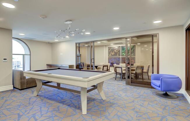 a room filled with furniture and a large window