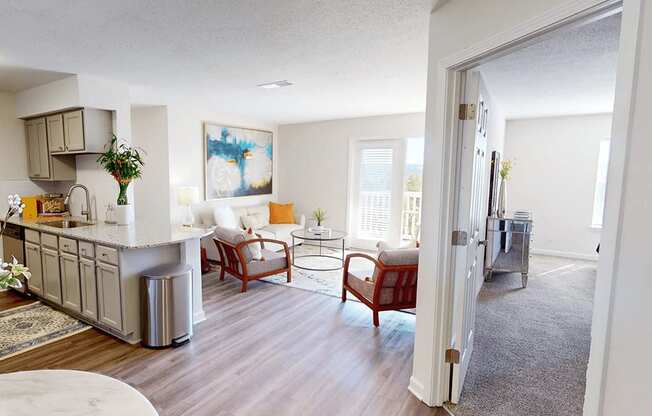 a living room with a kitchen and a dining room