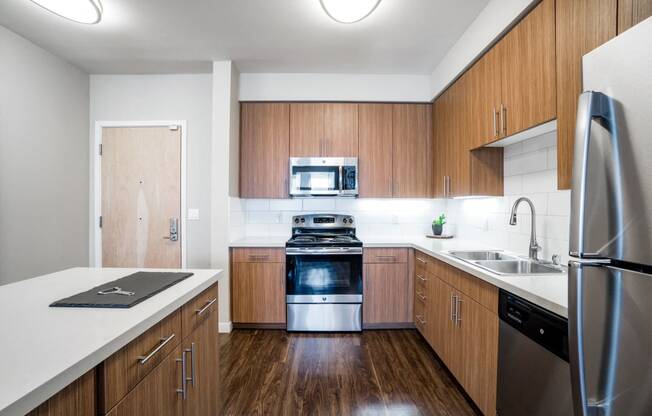 Santa Clara CA Apartments for Rent - Spacious Kitchen with Modern Interior and Amenities Such as Stainless Steel Fridge, Stove, Dishwasher, and Microwave