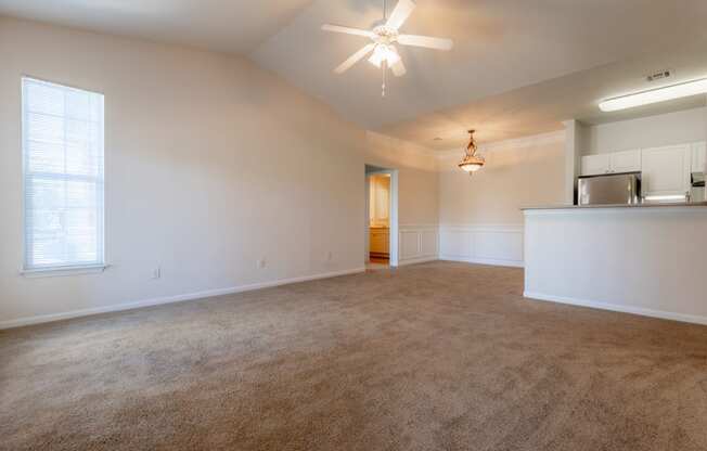 Living room with window light and ceiling fan and lights2 at Wynnewood Farms Apartments, Overland Park, Kansas