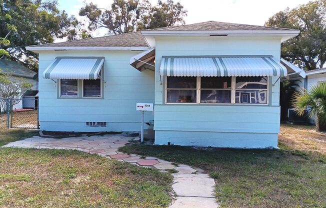 Cutie bungalow features hardwood floors and big back yard