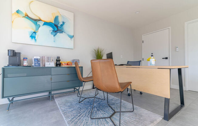 a desk and chair in a room with a door at BLVD Apartments LLC, Tarzana, 91356