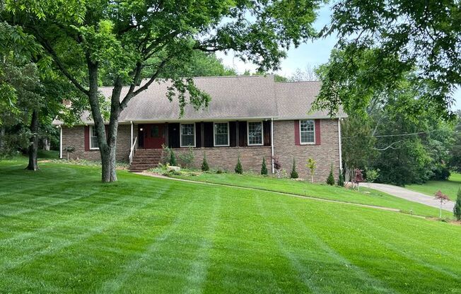 Single Family Home on almost an acre, 4 beds, 3 baths, Front Porch, Great Storage Space, and Great Yard