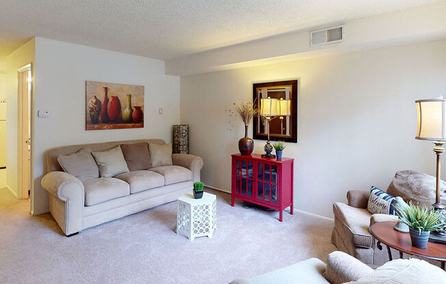 a living room with a couch and a table