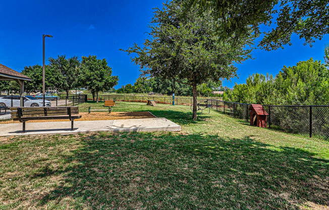 a park with a bench and a tree at Discovery at Craig Ranch, McKinney, 75070