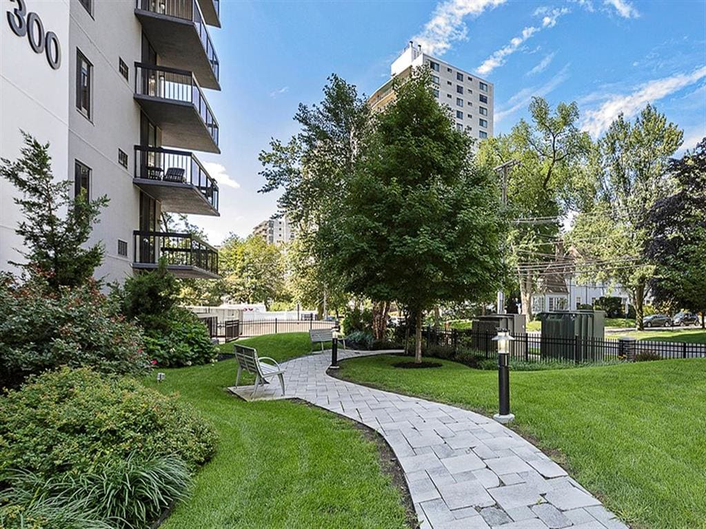 Exterior shot of winding pathway on green grass, at Prospect Place, NJ 07601