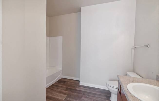 an empty bathroom with a toilet and a sink at St. Augustine Estate, Dallas, Texas