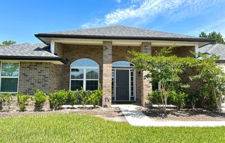 Like New 4/2 fully brick home with huge yard