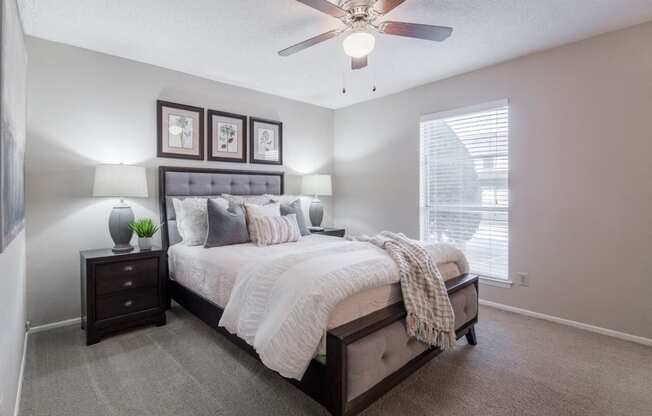 Spacious bedroom with ceiling fan  at Country Square, Carrollton, Texas