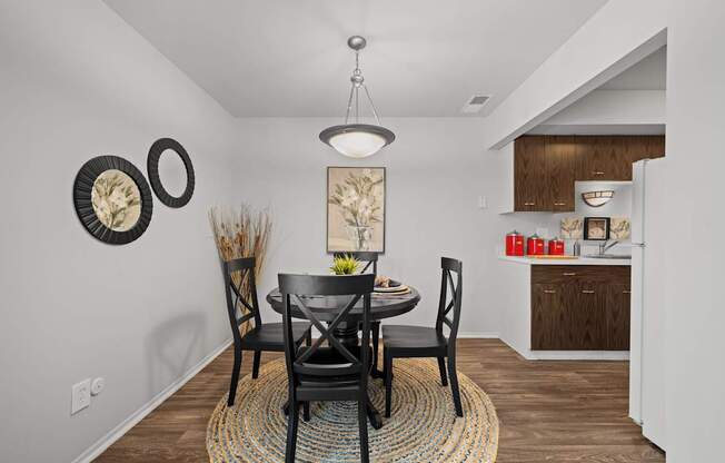 Spacious dining room area ta Knottingham Apartments in Clinton Township, MI.
